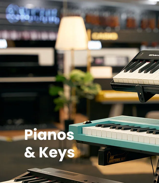 Digital keyboards and pianos displayed in a showroom